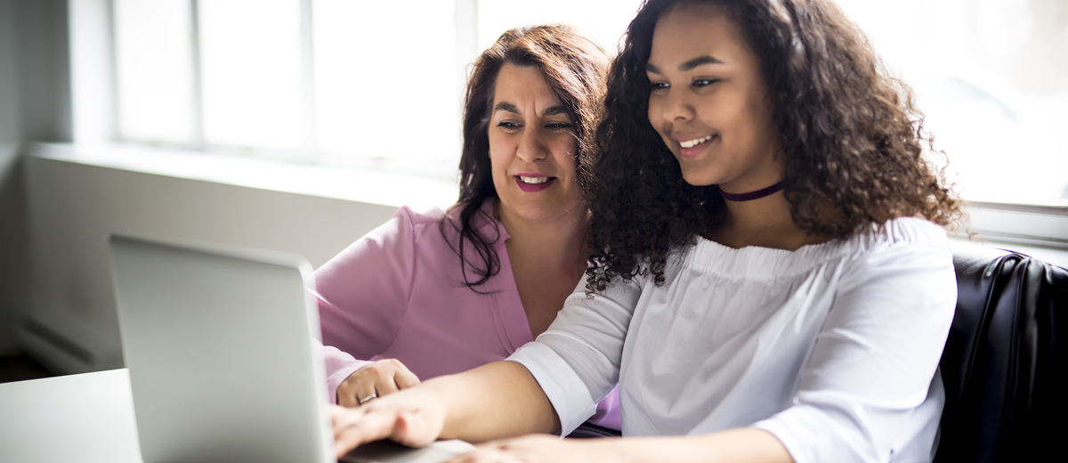 Parent with student on computer